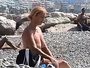 Hot milf gets nude at the beach and shows off her impressive bod Topless big tits Voyeur beach